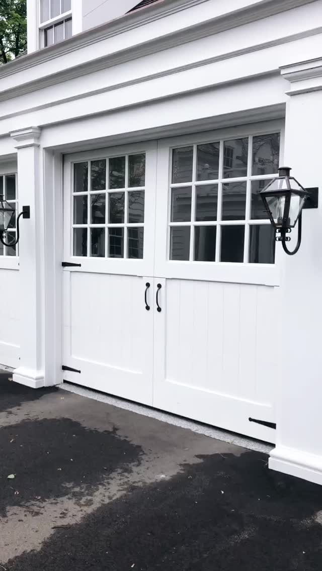 Craftsman Style Garage Doors: 8 Ideas from Carriage House to Modern Grey 6 White craftsman style garage door with window panes and black hardware on a white building.