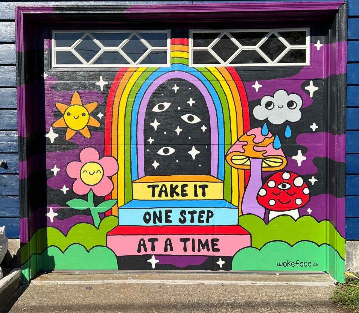 9 Garage Door Makeover Ideas for Instant Curb Appeal 6 A garage door decorated with a vibrant, colorful psychedelic mural featuring rainbows, mushrooms, and stars.