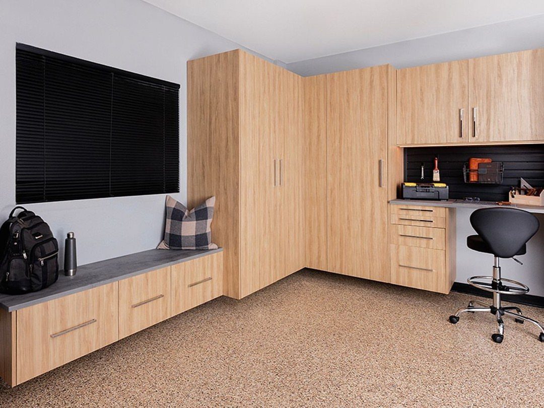 Turning a Garage to a Studio Apartment: 9 Layouts That Work 9 Light wood grain cabinets, tall wardrobes, and a low storage bench in a room.